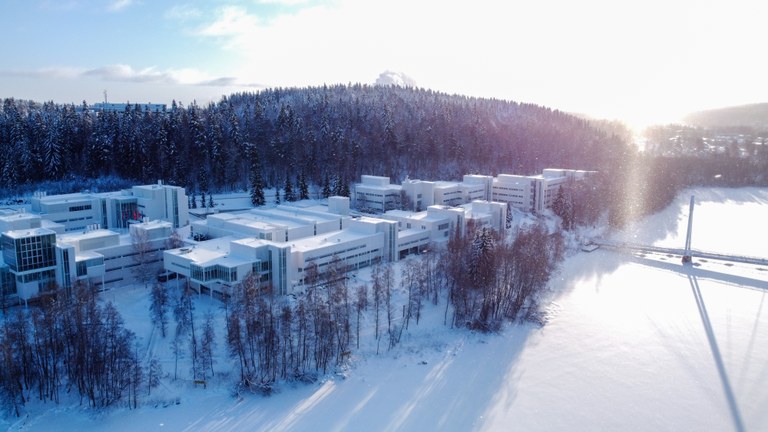 Ylistönmäki campus covered in snow, frozen lake Jyväsjärvi